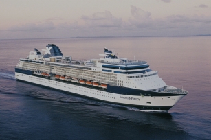 Aerial view of the Celebrity Infinity cruise ship during the sun set as the pink hue against the sea
