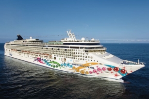 image of the Norwegian Pearl cruise ship gliding through the waters
