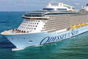 close up of the front of the cruise ship Odyssey of the Seas featuring the name of the ship 