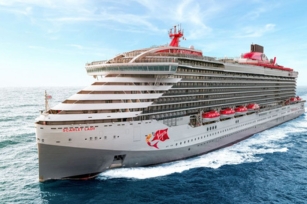 close up image of the Scarlet Lady cruise ship cruising through the waters