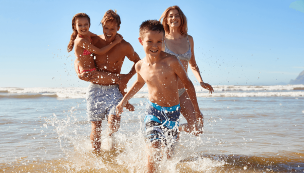 family at beach on holiday.